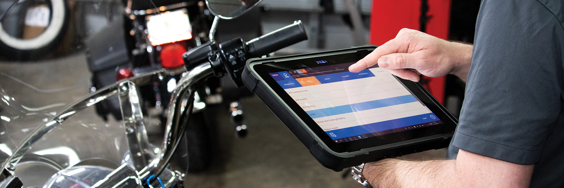 Worker looking at a tablet with TEXA Bike Information